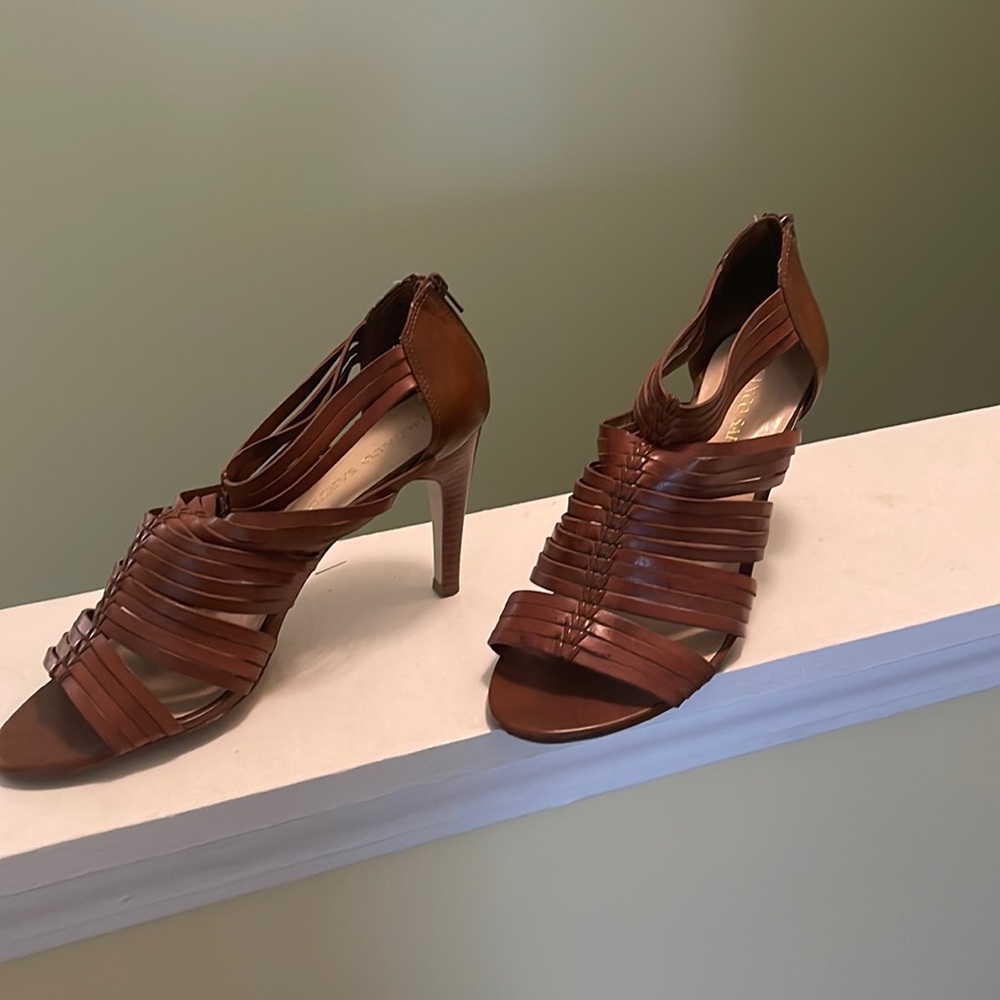 Brown sandals with a zipper up the back
